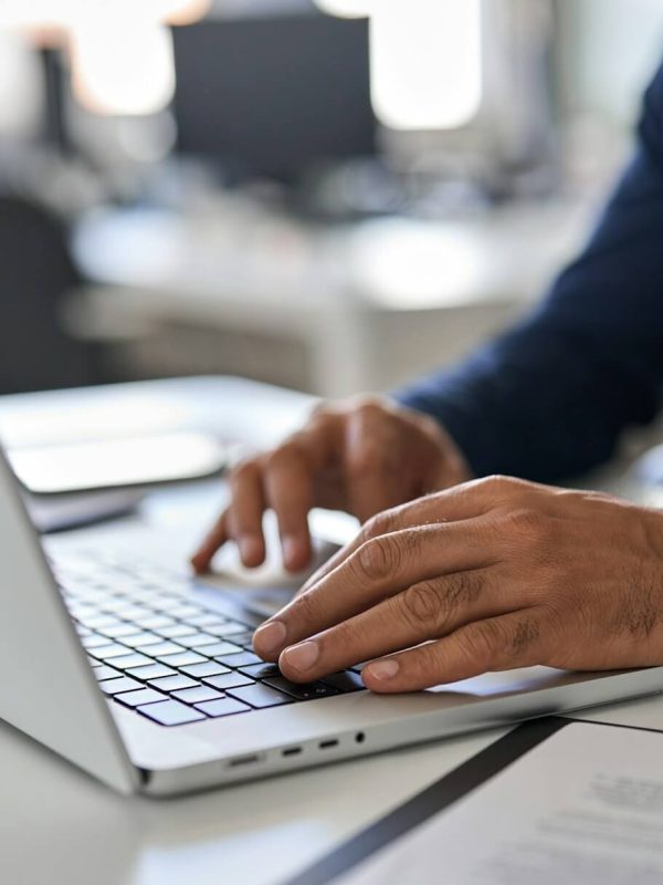 hands-of-business-man-typing-on-laptop-working-with-ai-solutions-on-computer-.jpg